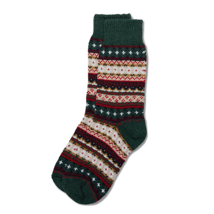 A colorful cotton sock in a fair isle pattern in shades of forest green, cream, and red.