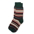 A colorful cotton sock in a fair isle pattern in shades of forest green, cream, and red.