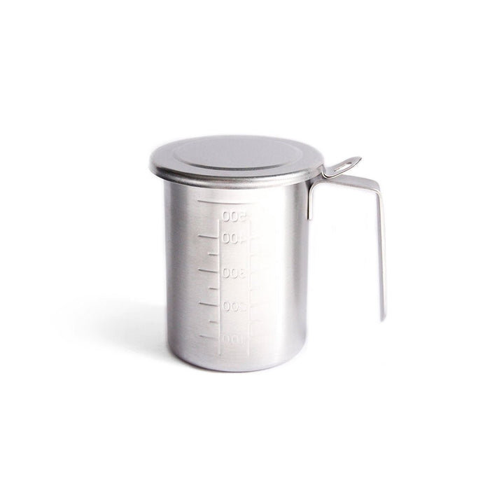 Stainless steel measuring cup with lid on a white background