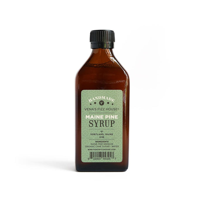 Bottle of Maine Pine Syrup with a label on a white background