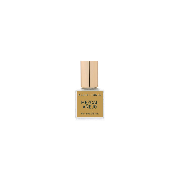 Gold perfume bottle labeled Mezcal Anejo by Kelly Jones on a white background