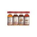 Set of four Runamok maple syrup bottles in clear packaging.