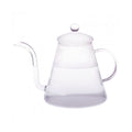 Clear glass pour over teapot with long neck and lid on white background