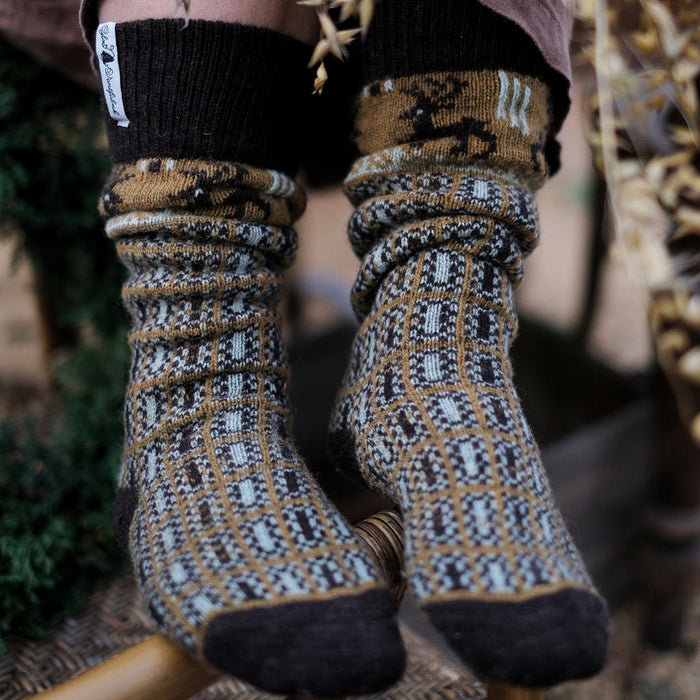 Close-up of model wearing patterned wool socks.