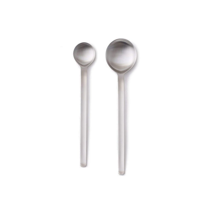 Stainless steel teaspoon and tablespoon on white background