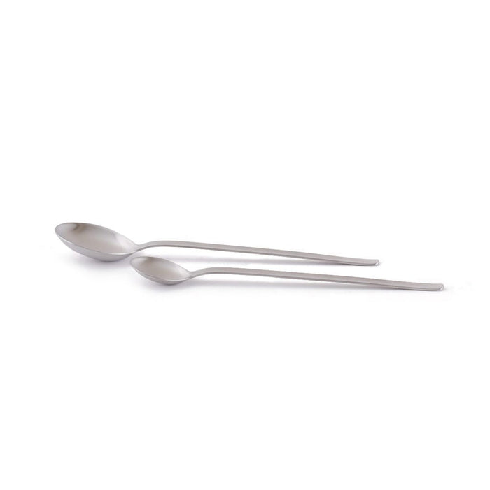Stainless steel measuring spoons on white background